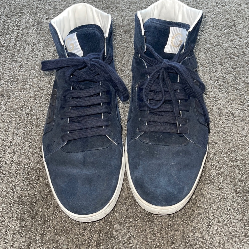 Men’s Gucci hightop sneakers.
